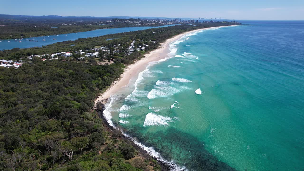 Aerial View of Stunning Coastline with Turquoise Water and City Skyline