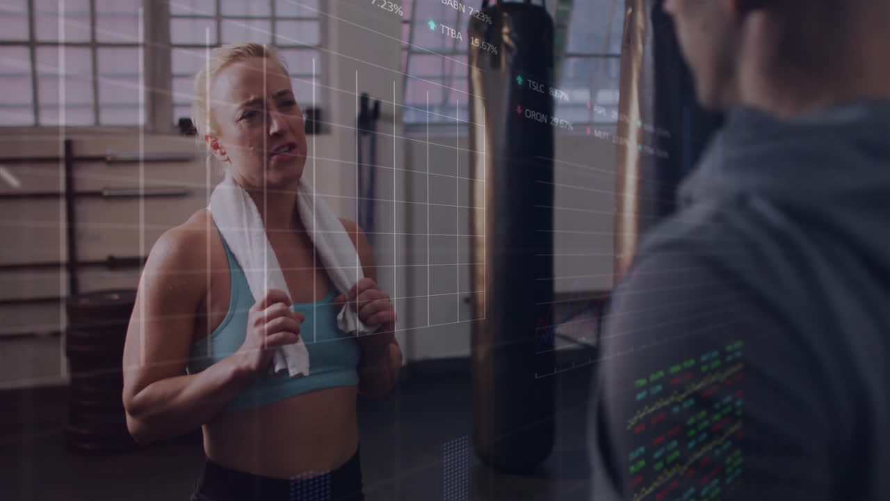 Woman with towel talking to person, financial data processing animation over scene