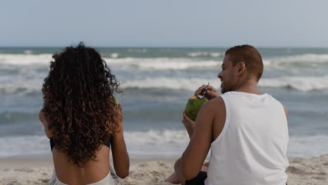 couple enjoying coconut drink