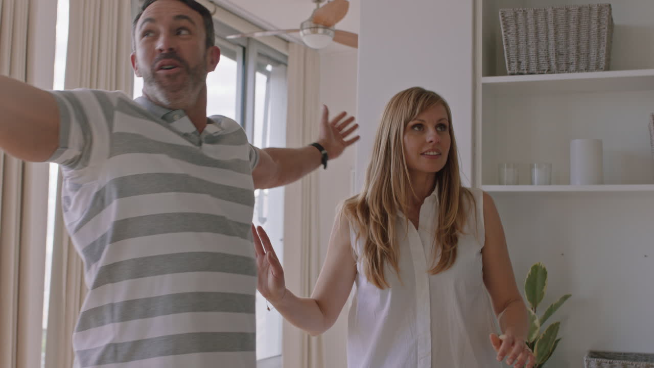 happy couple moving into new apartment together celebrating relationship milestone hugging enjoying successful property investment