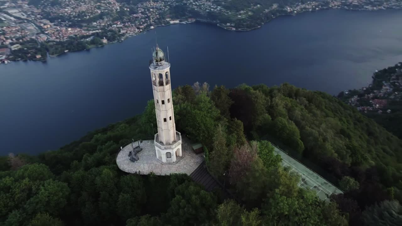 Aerial of The Faro Voltiano lighthouse overlooking Lake Como, Italy