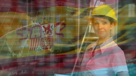 spanish flag over site worker working on plans.