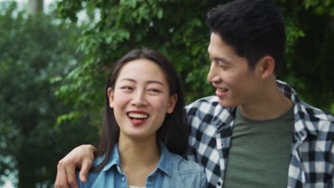 Handheld-view-of-Vietnamese-young-couple-walking-on-fresh-air