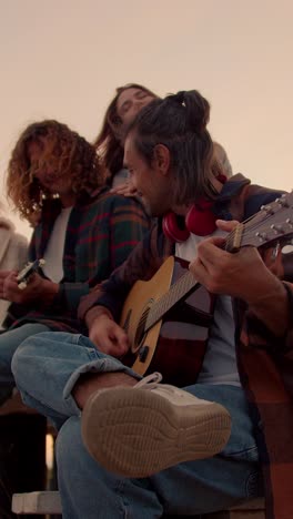friends playing music outdoors