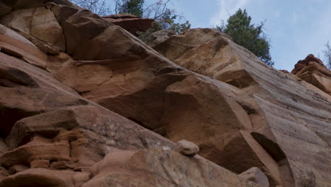 Pan-across-a-craggy,-red-rock-face-in-Utah