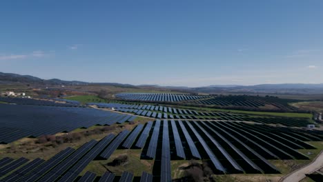 vast portuguese solar farm harnessing sunlight - aerial flyover reveal