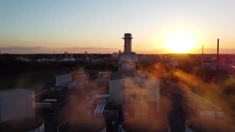 smoking chimneys in belgium industrial zone, aerial descend view