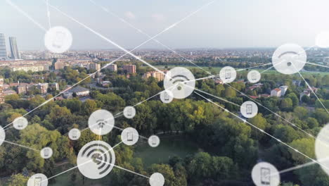 Animation of network of connections with icons over cityscape