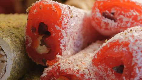 turkish delight with nuts, dried apricots, sprinkled with coconut. dolly food photography. close-up of turkish delight tubules. ramadan