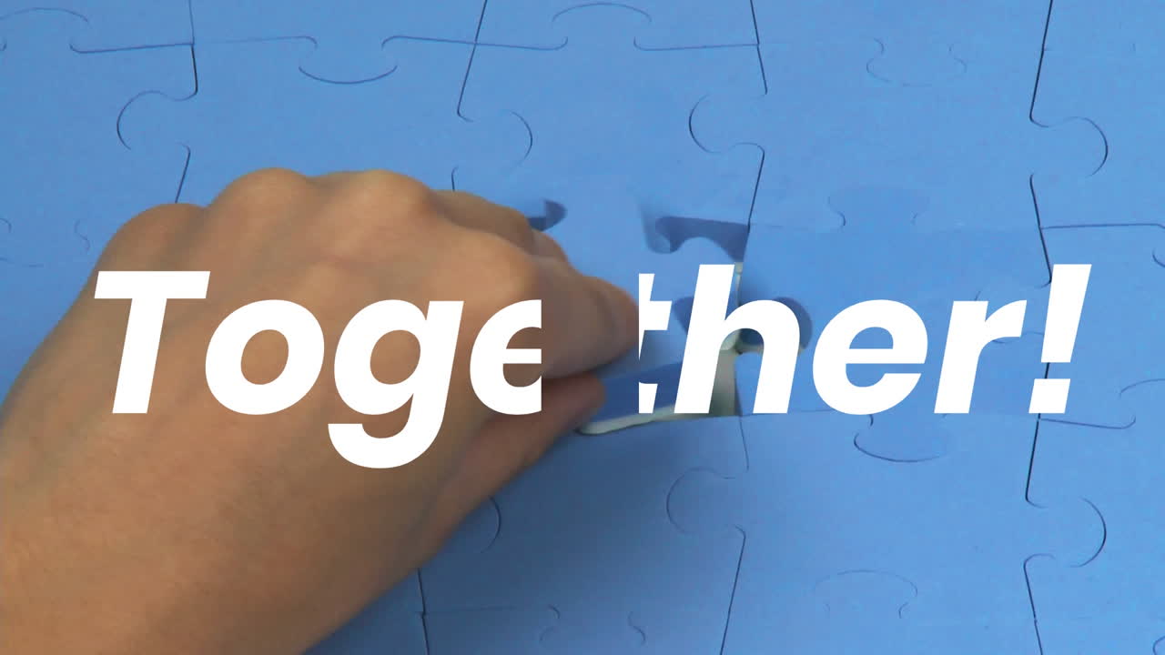 Caucasian man making a puzzle during coronavirus covid19 pandemic with words Together!