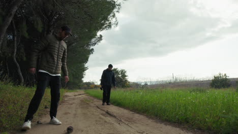 elderly dad and son walk in a park for an afternoon pastime