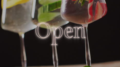 animation of open neon text and cocktails on black background