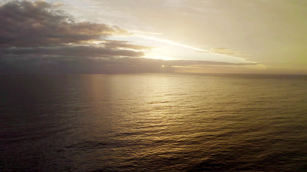 A sunset is the sun's fiery kiss to the night