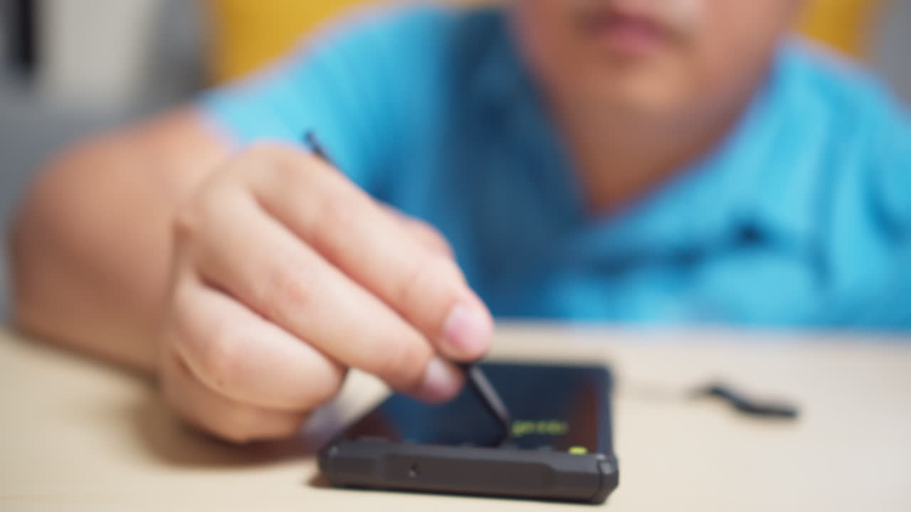 Men use stylus pen technology on a smartphone to write and work with digital applications