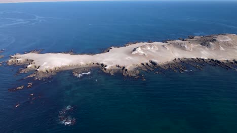 isla la asuncion side view on sunny day of dry rocky island