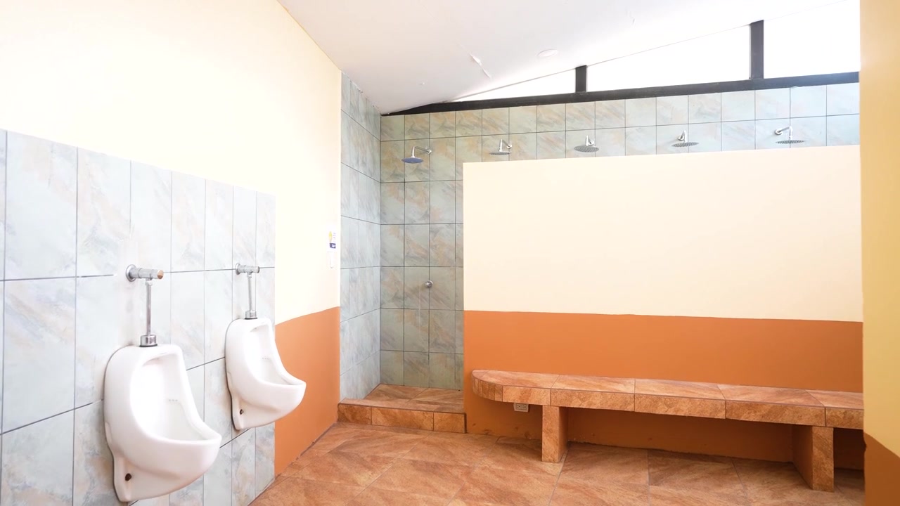 Cinematic footage of a school restroom featuring sinks, sanitary equipment, and organized educational institution facilities.