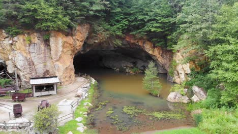 4k drone video of mine cave at emerald village near little switzerland, nc on summer day