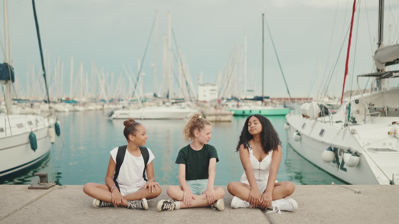 Girls enjoying a sunny day at the harbor
