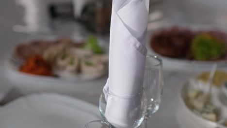 Napkin-in-a-goblet-on-the-table-in-a-restaurant