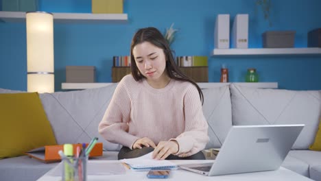 asian young woman depressed and unhappy in her home office.