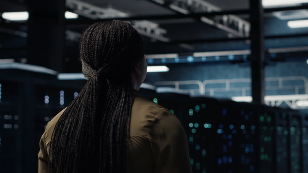 Programmer overseeing server farm, ensuring compliance with industry standards