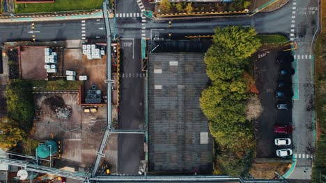 industrial-plant-with-a-futuristic-looking-aerial-drone-footage,-with-a-steampunk-look-with-industrial-buildings-and-vehicles