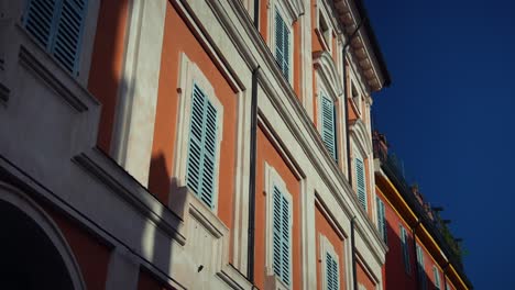 colorful european townhouses with shutters