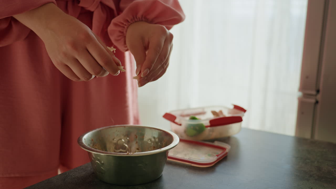 Woman Preparing Food, Kitchen Scene With Woman Mixing Eggs And Ingredients In Sunlight, Woman Standing At Sunlit Kitchen Counter As She Prepares Lunch Ingredients And Mixes Eggs In Bowl