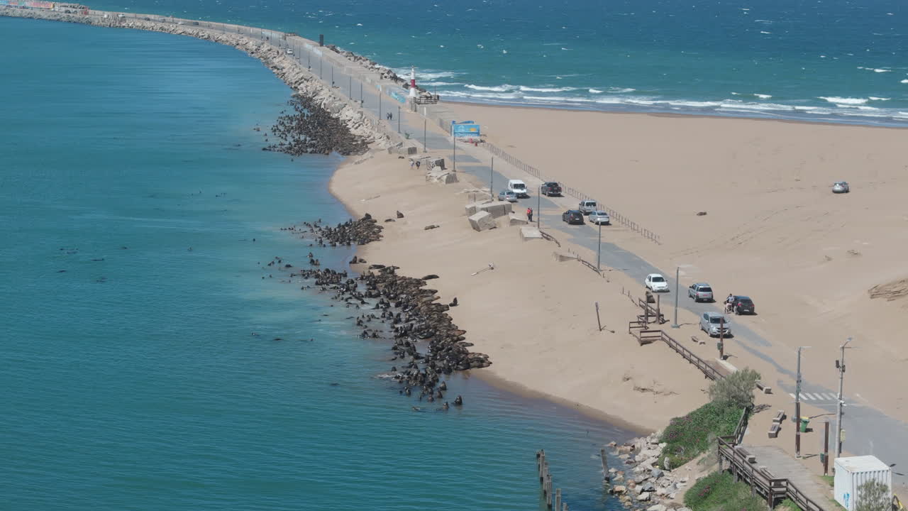 Amazing drone movement along the beautiful beach of Escollera Quequén, Necochea, Argentina.