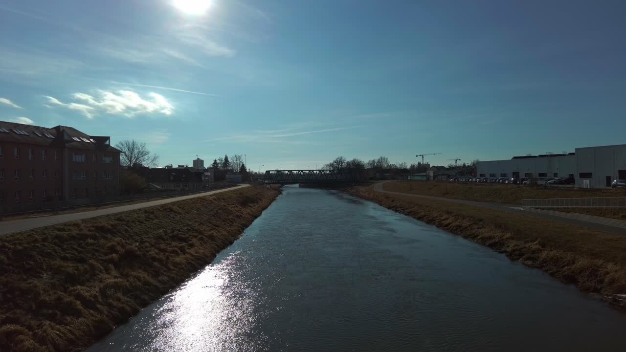 Static view of the Morava River flowing through the city of Olomouc on a calm and sunny day