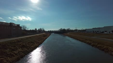 static view of the morava river flowing through the city of olomouc on a calm and sunny day