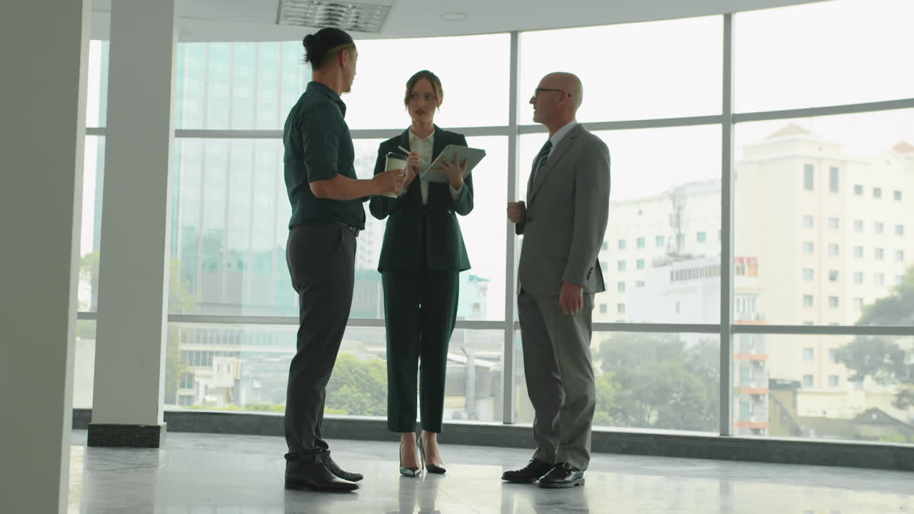 Three Entrepreneurs Talking at Hall of Business Center