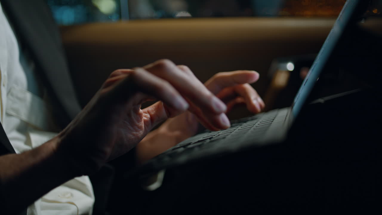 Man fingers typing computer keyboard vehicle closeup. Specialist working tablet