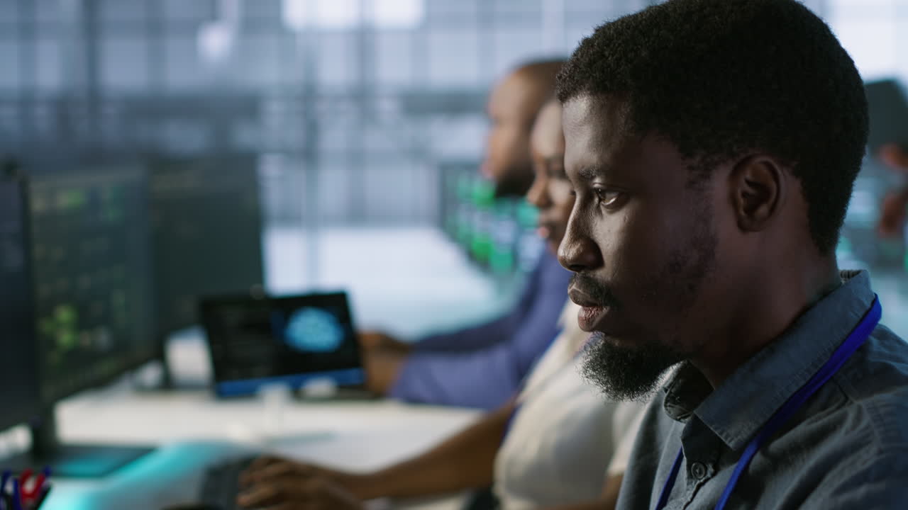 Team of IT Professionals Working in a Data Center