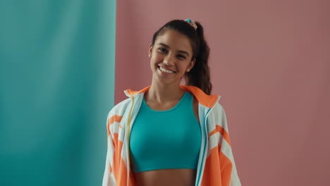 portrait of a smiling young woman in sportswear
