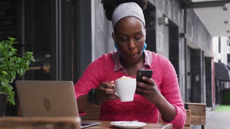 african american sitting in a cafe