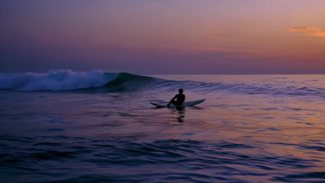 surfer at sunset on the ocean