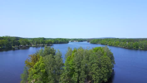 Gorgeous-aerial-top-view-flight-Natural-Summer-Paradise-idyllic-Island-in-Lake,-Chlum-in-Czech,-day-2023