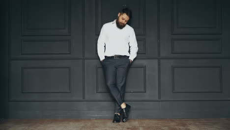 gentleman posing in studio. portrait of stylish handsome man with beard in studio