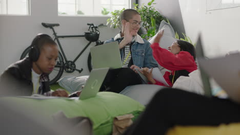 young-group-of-business-people-students-working-together-sharing-information-brainstorming-ideas-studying-using-laptop-computer-technology-successful-high-five-in-relaxed-office-workplace