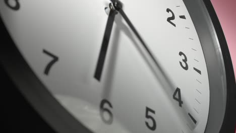 clock face on rosy rose pink wall in time lapse