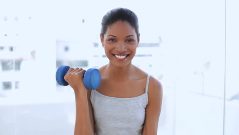 Beautiful-woman-holding-dumbbells