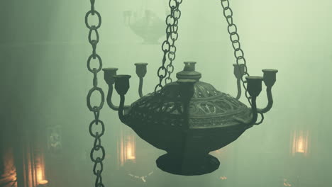 antique chandelier in a foggy chapel