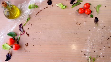 chef in rubber gloves puts bacon pizza on a wooden board on the table.