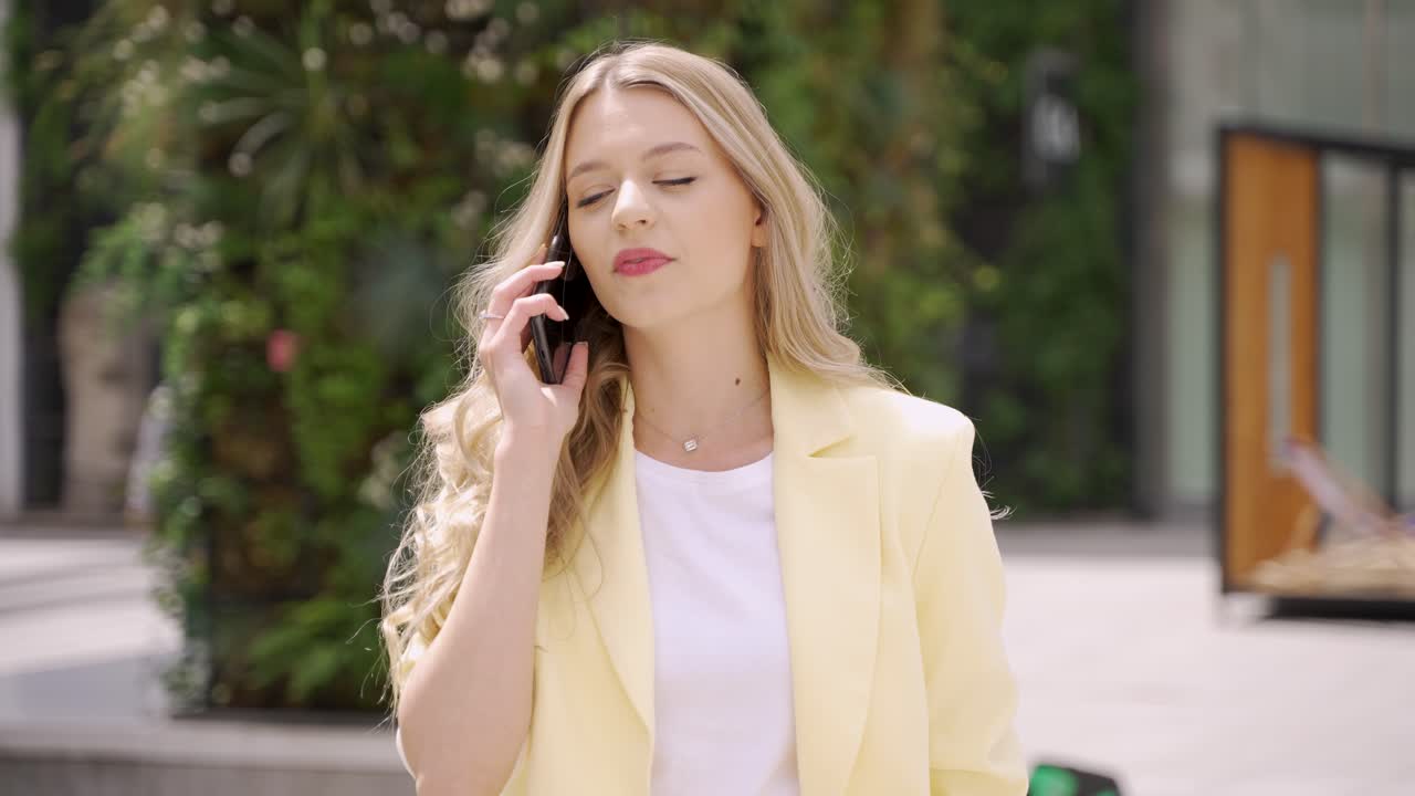 Woman talking on phone outdoors