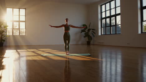 woman practicing yoga in a studio