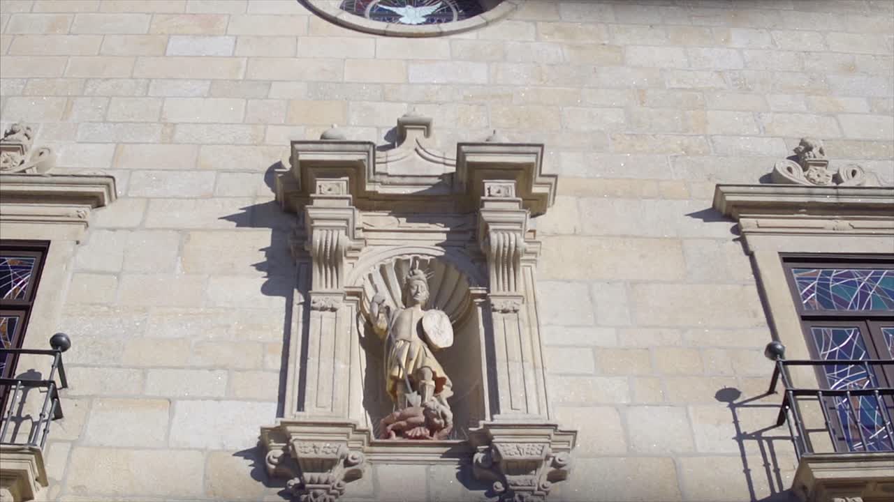 Church Exterior with Stone Facade and Stained Glass Windows