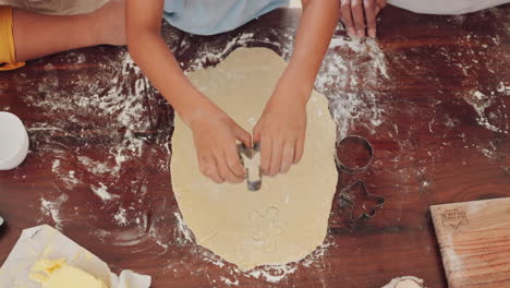 kid, hands and baking with dough in top view