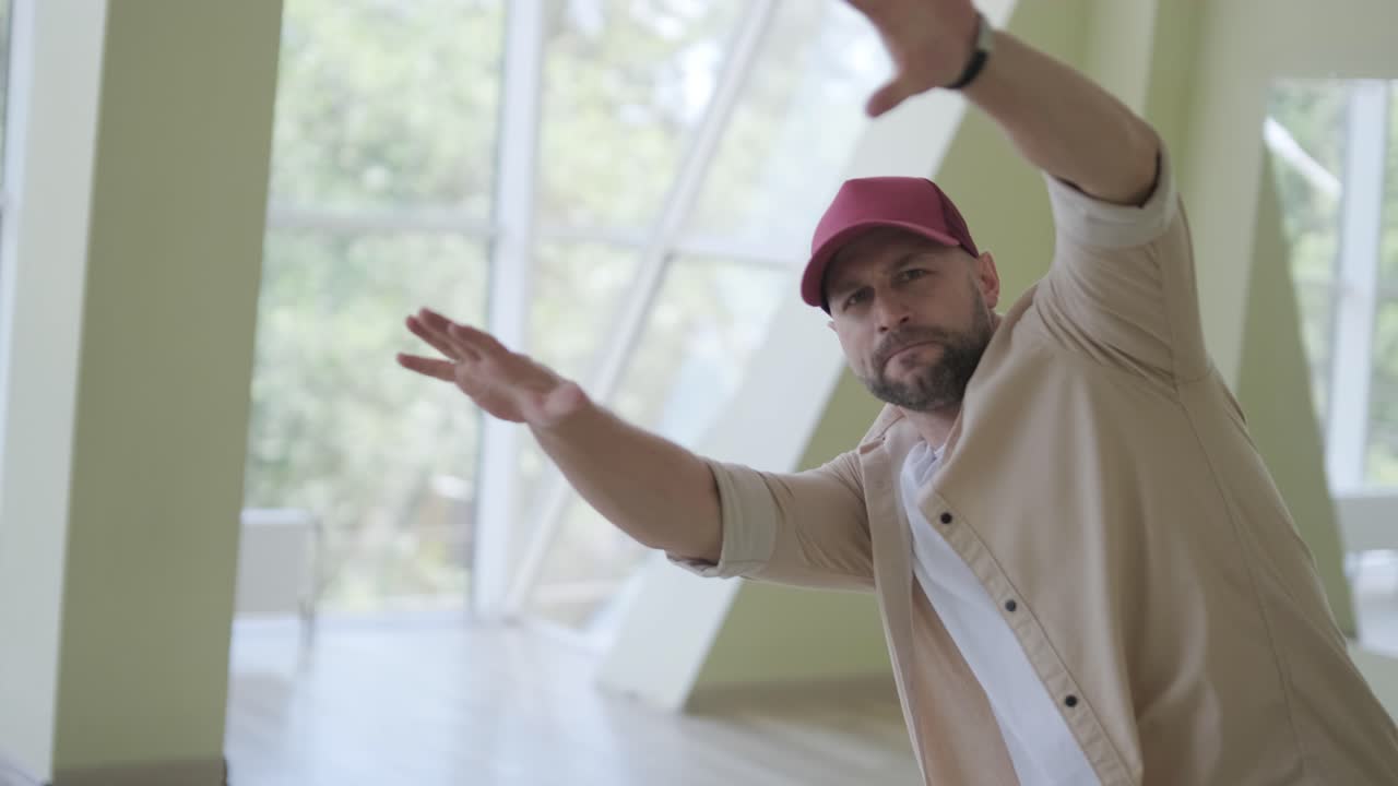 Man Breakdancing in Modern Studio