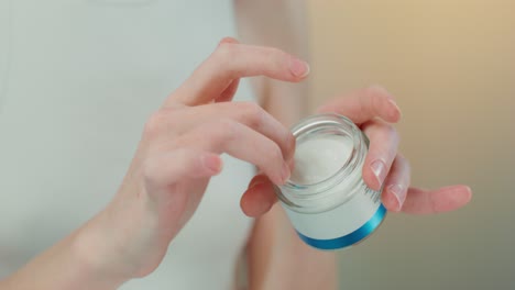 woman applying face cream